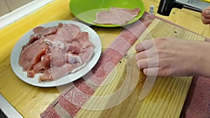 A chef pounding meat. Close-up shot