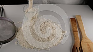 chef pouring flour