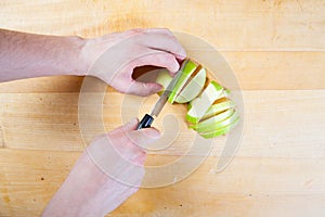 Chef prepare apple in the kitchen