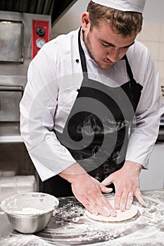 Chef prepare traditional pizza dough flour messy