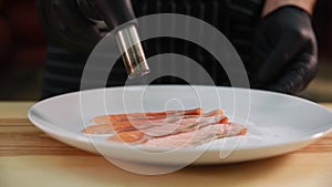 Chef prepares grilled dishes on a barbecue