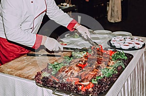 Chef prepares meat dish vegetables restaurant