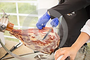 The Chef Prepares Meat Jamon. Professional Slicing Jamon Serrano, Traditional Spanish Ham
