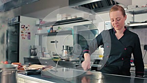 Chef prepares stove before cooking