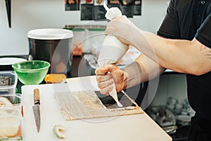 The chef prepares sushi. Preparing of the sushi