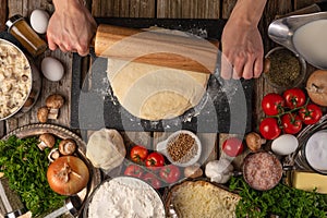 The chef prepares and works with the dough making italian pizza or pasta. Cooking Ingredients Top View Cooking Cooking Concept and