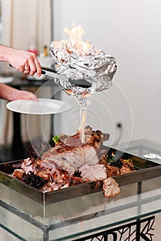 Chef preparing baked Turkey on a platter in the fire. Roast Turkey.