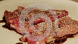 Chef preparing beef steak with soy sauce marinade