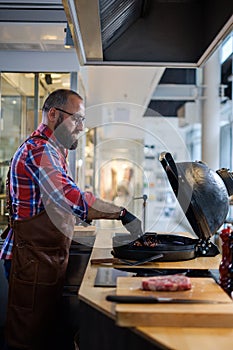 Chef preparing charcoals before grilling in a restaurant