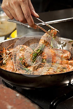 Chef preparing delicious prawn