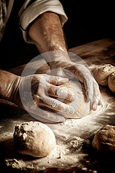 Chef preparing dough working on a wooden table, close up
