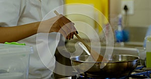 Chef preparing food in kitchen at restaurant 4k