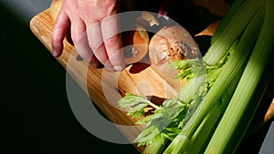 Chef preparing fresh vegetables ingredients prepared on chopping board