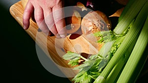 Chef preparing fresh vegetables ingredients prepared on chopping board