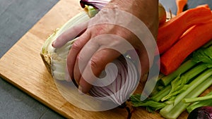 Chef preparing fresh vegetables ingredients prepared on chopping board