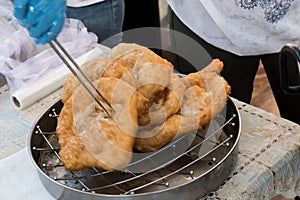 Chef preparing fried churros or donuts and pancakes during brunch buffet in the garden. Food Buffet Brunch Catering Dining Eating