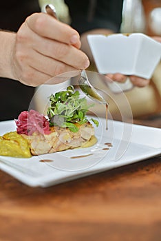 Chef preparing lamb dish