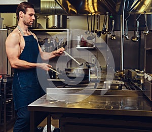 The chef preparing meat on a dry pan.