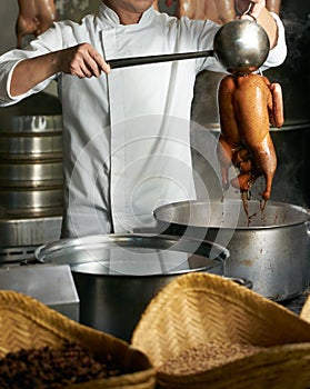 Chef preparing of Peking Roast Duck