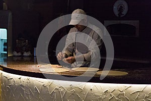 Chef preparing pizza at a cooking contest