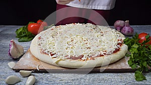 Chef preparing a pizza. Frame. Pizza Place. Food Preparation. Pizza Chef. Chef tossing pizza dough in commercial kitchen
