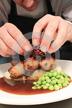 Chef preparing sausage dinner