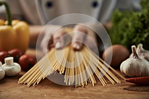 Chef preparing spaghetti