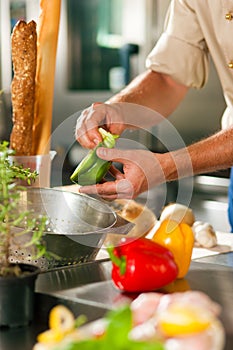 Chef preparing vegetables photo