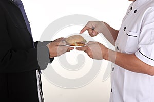 Chef present Hamburger to custome
