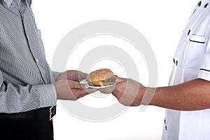 Chef present Hamburger to customer