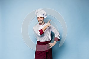 Chef presenting something over light blue background
