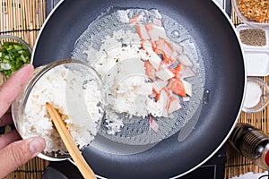 Chef put cooking rice to pan