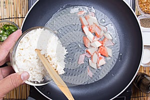 Chef put cooking rice to pan