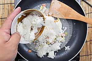 Chef put cooking rice to pan