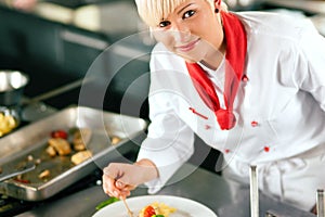 Chef in restaurant kitchen cooking