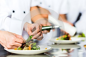 Chef in restaurant kitchen cooking