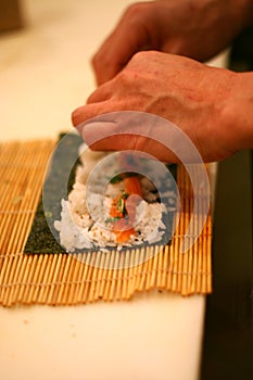 Chef Rolling Sushi Roll