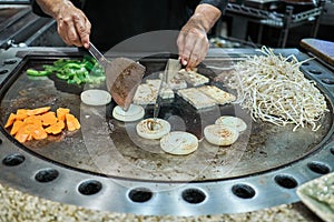 Grilling vegetables at a tepanyaki restaurant at Guam, USA