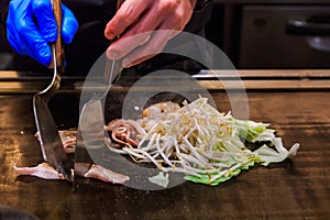 Chef`s Hands making yakisoba ,Japanese hot pan fried noodle, selected focus