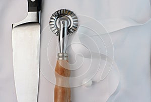 Chef's knife, pastry cutter and uniform