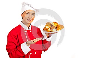 Chef serves croissants with pears photo