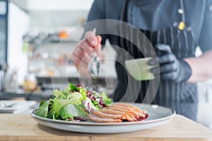 The chef serves roast duck.