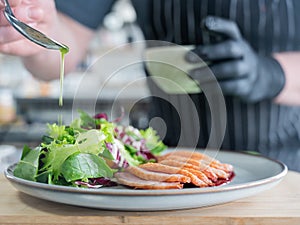 The chef serves roast duck.