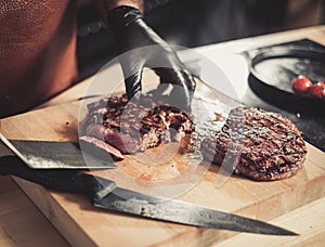 Chef serving freshly cooked meat in a restaurant