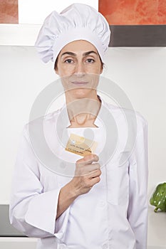 Chef showing credit card