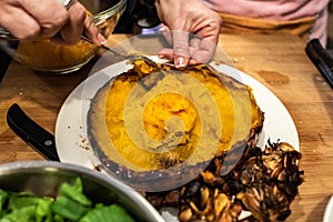 Chef slaughtering a roasted pumpkin