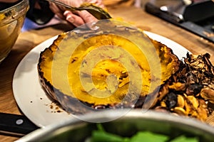 Chef slaughtering a roasted pumpkin
