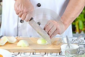 Chef sliced onions