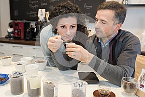 Chef smelling coffee beans