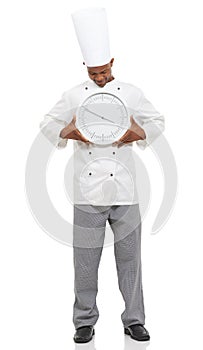 Chef, smile and man with clock for time, speed or deadline isolated on white studio background. Cooking professional
